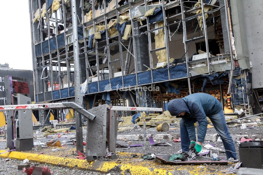 A man bends over a piece of debris outside a shopping mall in the Solomianskyi district damaged by a Russian attack, Kyiv, Ukraine, October 19, 2026. During the night and morning, Russia launched a massive strike on the capital using ballistic missiles, cruise missiles, and drones. According to…