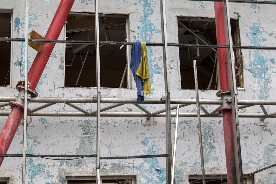 A tattered Ukrainian flag hangs on the scaffolds at a building in the Solomianskyi district damaged by a Russian attack, Kyiv, Ukraine, October 19, 2026. During the night and morning, Russia launched a massive strike on the capital using ballistic missiles, cruise missiles, and drones. According to…