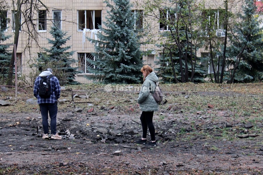 A man and a woman look at a crater from a Russian strike in the Solomianskyi district in Kyiv, Ukraine, on October 19, 2026. During the night and morning, Russia launched a massive strike on the capital using ballistic missiles, cruise missiles, and drones. According to Kyiv city head Vitali…