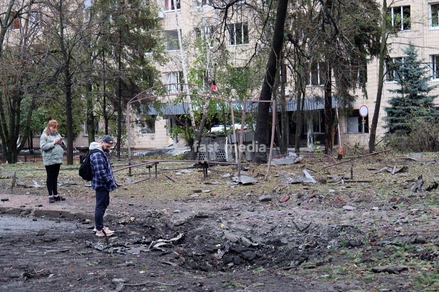 A man and a woman look at a crater from a Russian strike in the Solomianskyi district in Kyiv, Ukraine, on October 19, 2026. During the night and morning, Russia launched a massive strike on the capital using ballistic missiles, cruise missiles, and drones. According to Kyiv city head Vitali…
