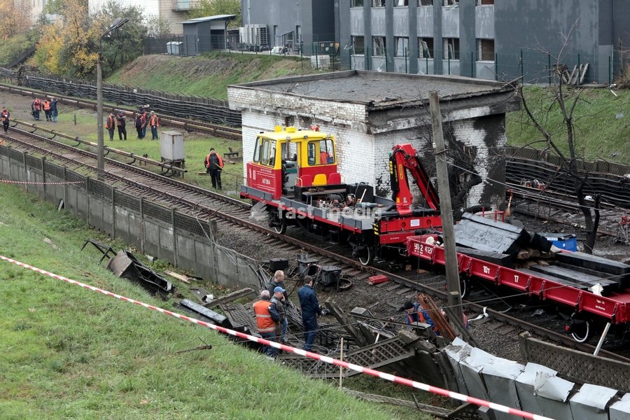 Repair workers restore cable networks near the Chernihivska metro station damaged by a Russian strike in Kyiv, Ukraine, on October 19, 2026. During the night and morning, Russia launched a strike on the capital with ballistic missiles, cruise missiles, and drones. According to the Kyiv City State…