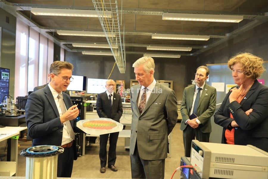 UGent Rector Petra De Sutter (R) and King Philippe - Filip of Belgium (C) are pictured during a visit to IGent, a research building at the UGent University where scientists and companies collaborate to develop innovative technologies, on Tuesday 20 October 2026, in Gent