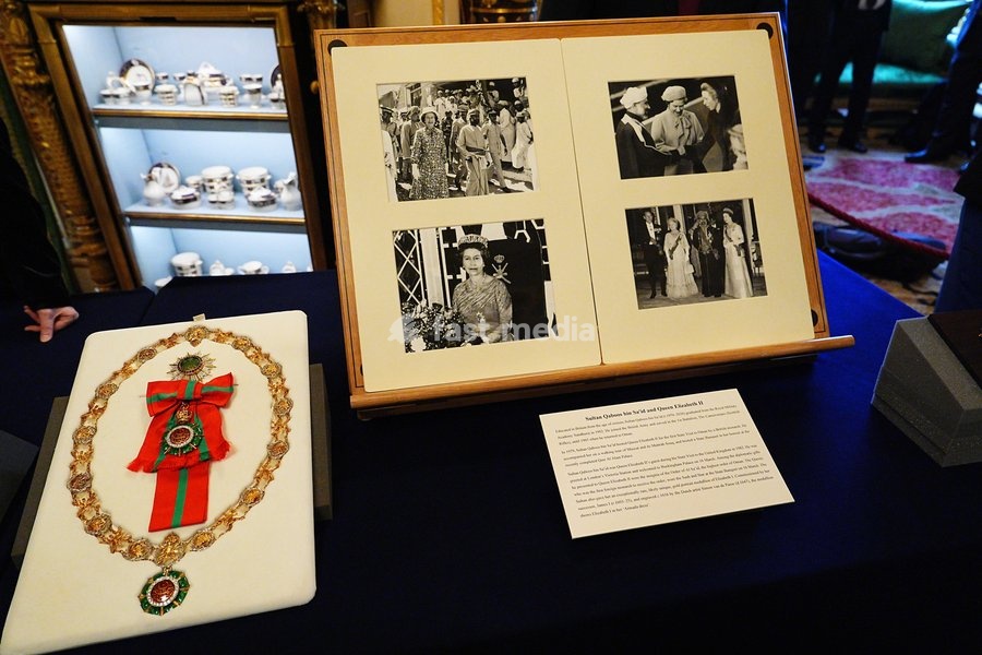 The Order of Al Sa'id presented to Queen Elizabeth II by Sultan Qaboos bin Sa'id during his 1982 State Visit to the UK (left) with photographs from Queen Elizabeth II’s 1979 State Visit to Oman and Sultan Qaboos bin Sa'id’s 1982 State Visit to the UK, which were some of the items on display from…