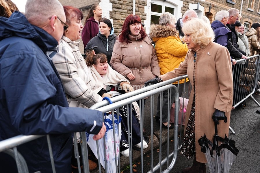 Queen Camilla speaks to members of the public lining the streets outside Aberfan Memorial Garden, where survivors, bereaved parents and members of the community are paying tribute to the 144 people who lost their lives in the Aberfan disaster on October 21 1966. Picture date: Wednesday October 21,…