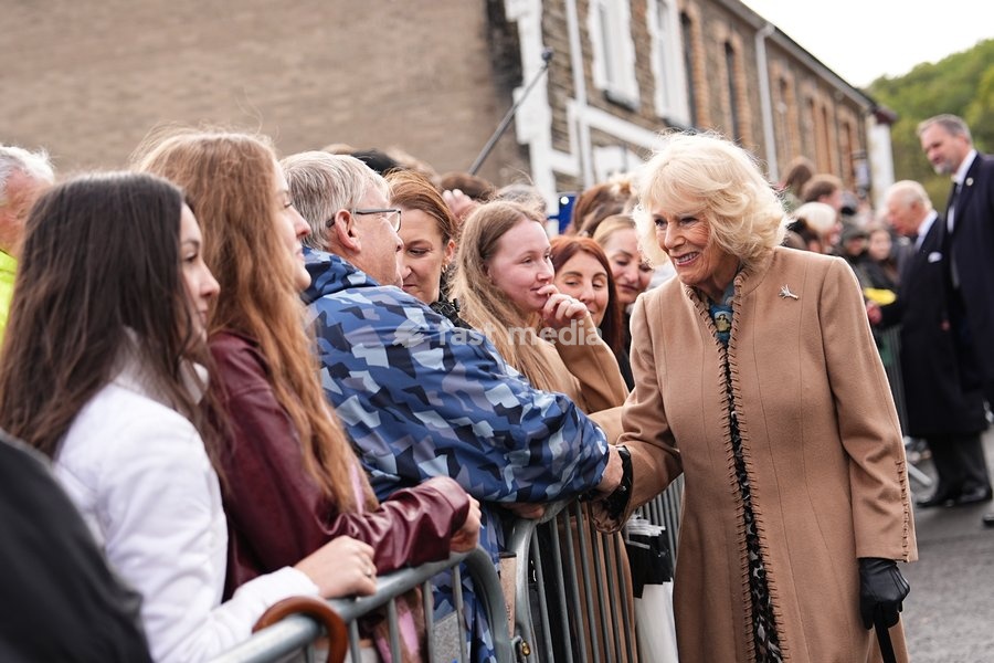 Queen Camilla speaks to members of the public lining the streets outside Aberfan Memorial Garden, where survivors, bereaved parents and members of the community are paying tribute to the 144 people who lost their lives in the Aberfan disaster on October 21 1966. Picture date: Wednesday October 21,…