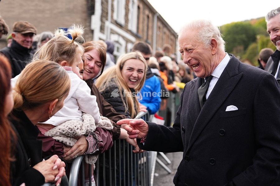 King Charles III speaks to members of the public lining the streets outside Aberfan Memorial Garden, where survivors, bereaved parents and members of the community are paying tribute to the 144 people who lost their lives in the Aberfan disaster on October 21 1966. Picture date: Wednesday October…