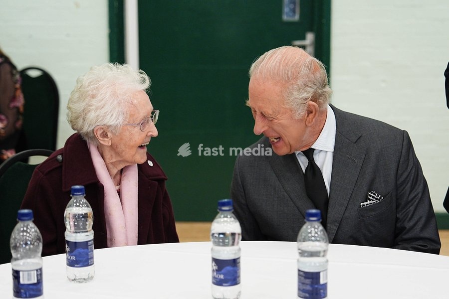 King Charles III speaking a member of the local community at Aberfan and Merthyr Vale Community Centre, during a visit to Aberfan to meet survivors, bereaved parents and members of the community and pay tribute to the 144 people who lost their lives in the Aberfan disaster on October 21 1966.…