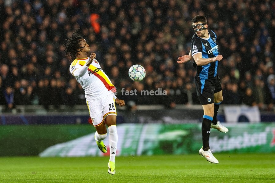 Lens' Junior Kadile and Club's Brandon Mechele fight for the ball during a soccer game between Belgian Club Brugge KV and French Racing Club de Lens, Wednesday 21 October 2026 in Brugge, on day three of the UEFA Champions League league phase