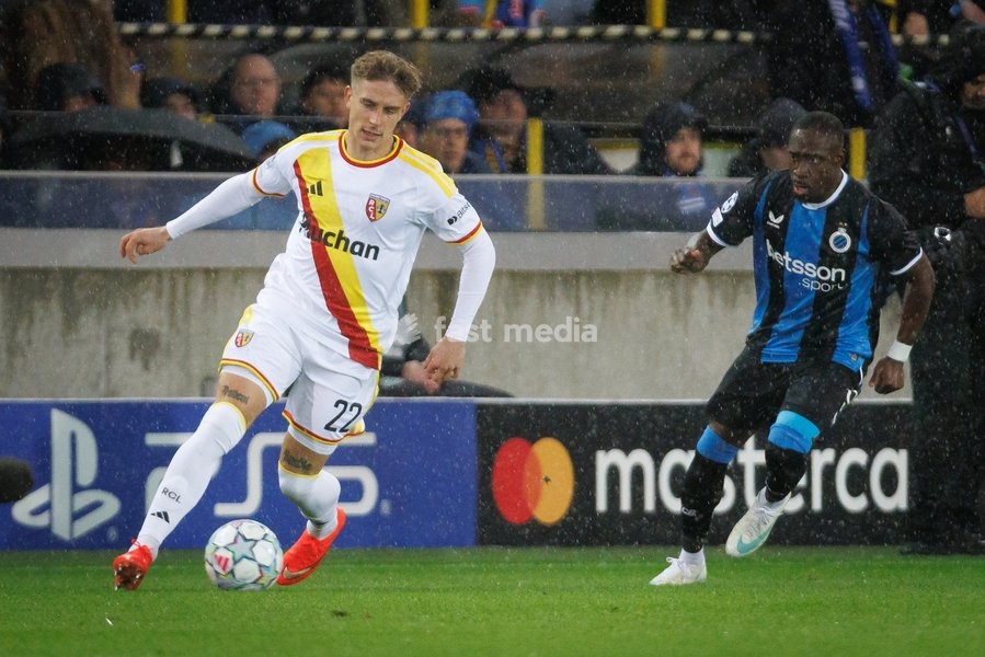 Lens' Michał Skoras and Club's Carlos Forbs fight for the ball during a soccer game between Belgian Club Brugge KV and French Racing Club de Lens, Wednesday 21 October 2026 in Brugge, on day three of the UEFA Champions League league phase