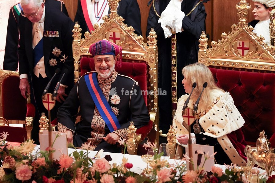 Oman's Sultan Haitham bin Tariq sits next to Lady Mayor of the City of London Dame Susan Langley as they attend the Guildhall State Banquet during his state visit to Britain, in London, October 21, 2026