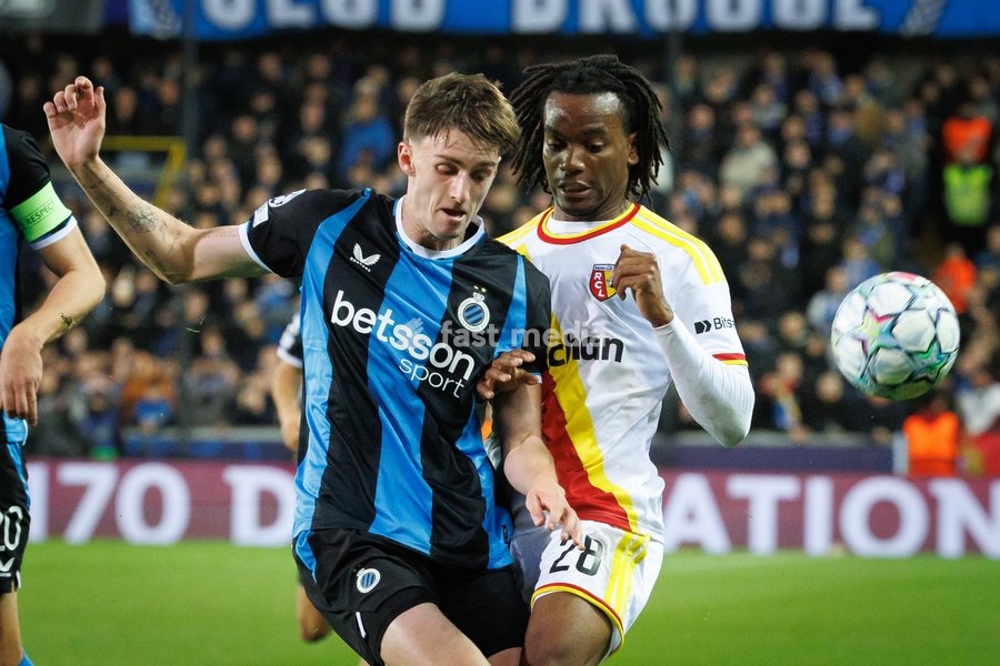Club's Jorne Spileers and Lens' Junior Kadile fight for the ball during a soccer game between Belgian Club Brugge KV and French Racing Club de Lens, Wednesday 21 October 2026 in Brugge, on day three of the UEFA Champions League league phase