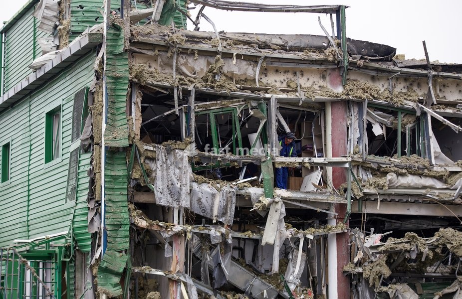 A man removes the rubble during a response effort to a Russian ballistic missile attack on an Epicentr K home improvement hypermarket and the surrounding shopping area in the Obolonskyi district, Kyiv, Ukraine, October 22, 2026. On Thursday night, Russian forces struck the Ukrainian capital with…