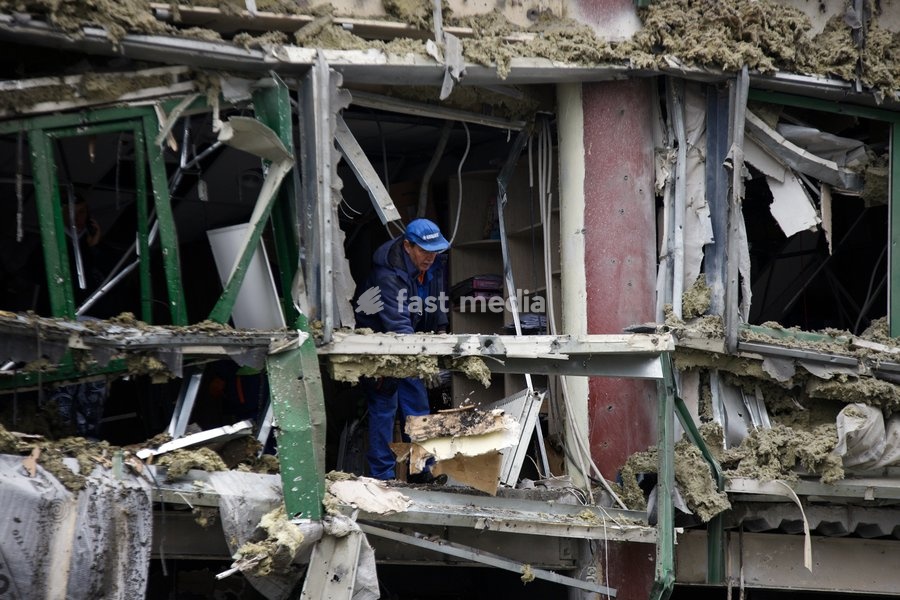 A man removes the rubble during a response effort to a Russian ballistic missile attack on an Epicentr K home improvement hypermarket and the surrounding shopping area in the Obolonskyi district, Kyiv, Ukraine, October 22, 2026. On Thursday night, Russian forces struck the Ukrainian capital with…