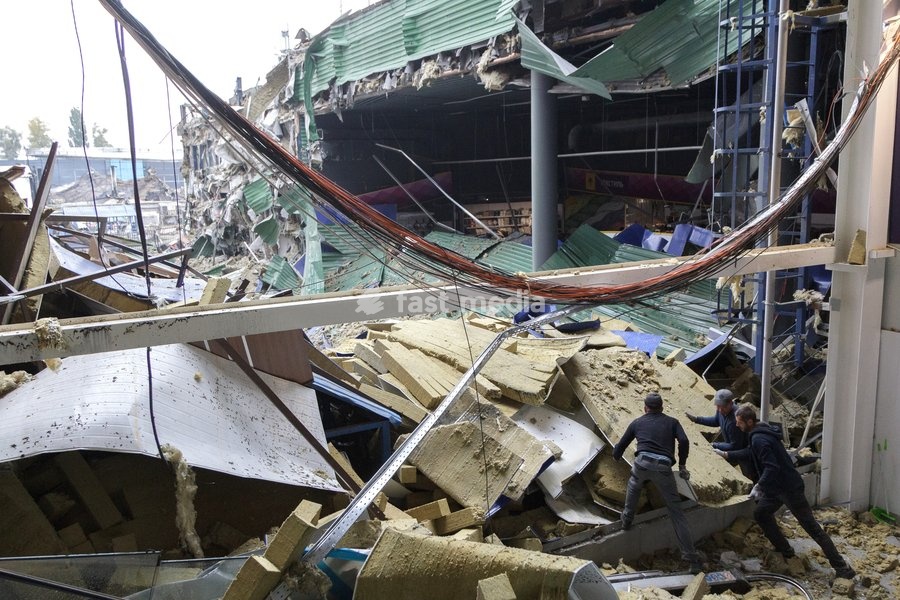 Workers remove the rubble at an Epicentr K home improvement hypermarket in the Obolonskyi district damaged by a Russian attack, Kyiv, Ukraine, October 22, 2026. On Thursday night, Russian forces struck the Ukrainian capital with ballistic missiles and drones. According to the Kyiv City Military…