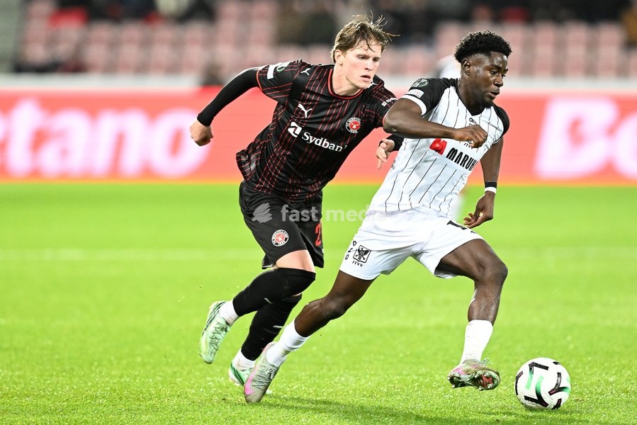 Midtjylland's Sofus Johannesen and STVV's Nathanael Mbuku pictured in action during a soccer game between Danish FC Midtjylland and Belgian Sint-Truidense VV, Thursday 22 October 2026 in Herning, Denmark, on the second day of the UEFA Conference League league phase