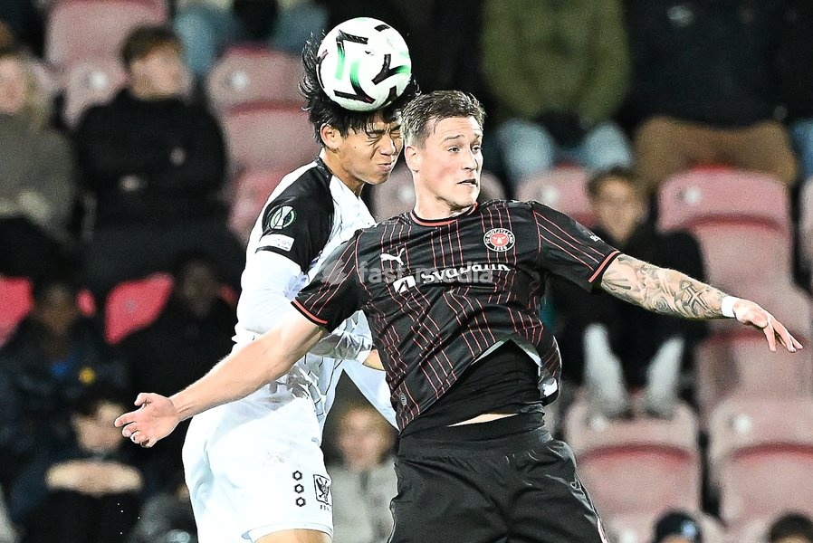 STVV's Kota Takai and Midtjylland's Mileta Rajovic pictured in action during a soccer game between Danish FC Midtjylland and Belgian Sint-Truidense VV, Thursday 22 October 2026 in Herning, Denmark, on the second day of the UEFA Conference League league phase
