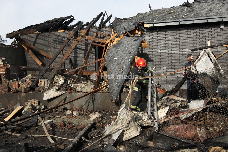 A rescuer responds to a Russian attack on a residential area in Dnipro, Ukraine, October 22, 2026. According to city head Borys Filatov, 11 private houses were damaged in the strike on Thursday morning, and one home burned down completely