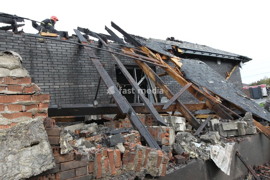 A rescuer responds to a Russian attack on a residential area in Dnipro, Ukraine, October 22, 2026. According to city head Borys Filatov, 11 private houses were damaged in the strike on Thursday morning, and one home burned down completely
