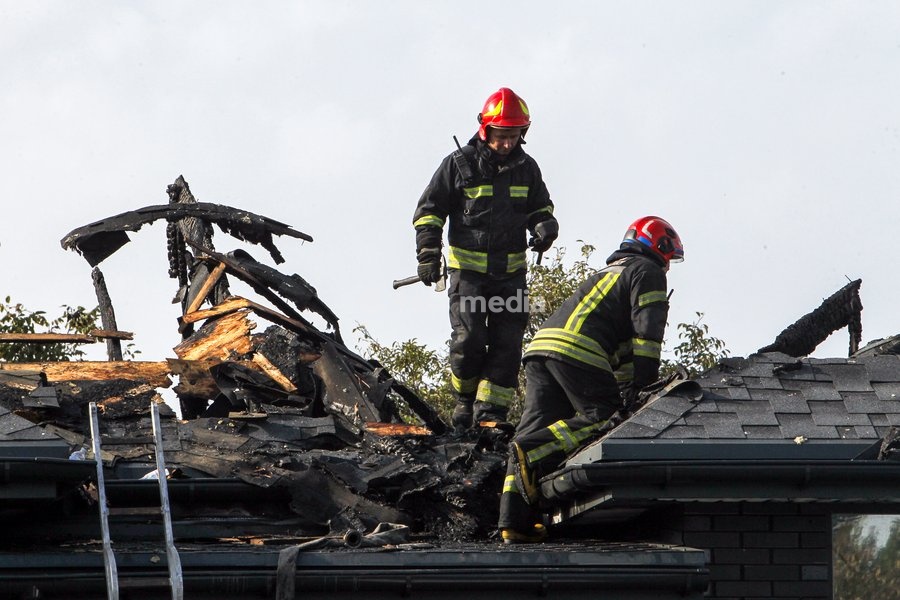 Rescuers respond to a Russian attack on a residential area in Dnipro, Ukraine, October 22, 2026. According to city head Borys Filatov, 11 private houses were damaged in the strike on Thursday morning, and one home burned down completely