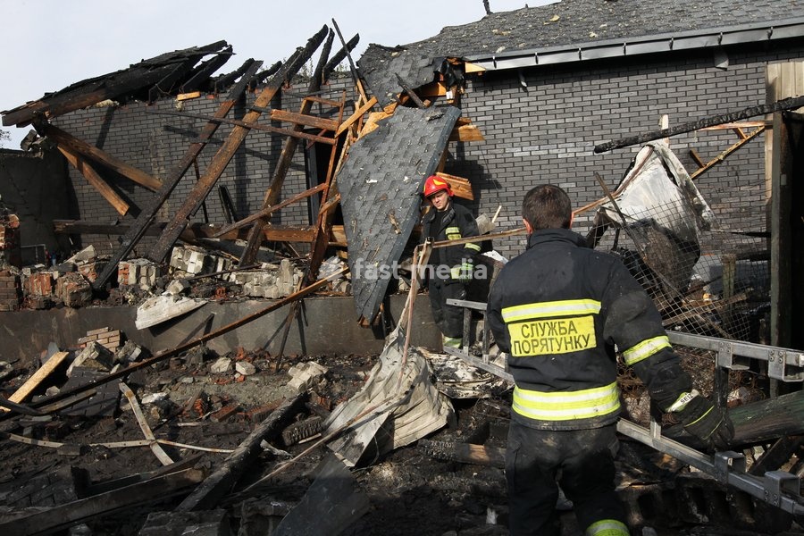 Rescuers respond to a Russian attack on a residential area in Dnipro, Ukraine, October 22, 2026. According to city head Borys Filatov, 11 private houses were damaged in the strike on Thursday morning, and one home burned down completely