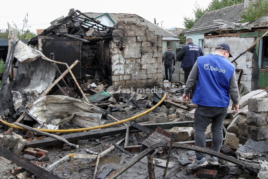 Men explore the ruins in a residential area which came under a Russian attack in Dnipro, Ukraine, October 22, 2026. According to city head Borys Filatov, 11 private houses were damaged in the strike on Thursday morning, and one home burned down completely