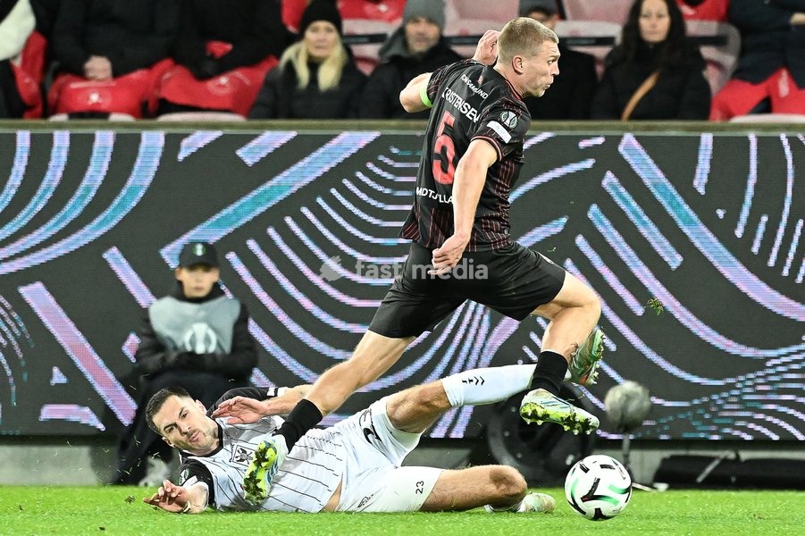 STVV's Joedrick Pupe and Midtjylland's Rasmus Kristensen pictured in action during a soccer game between Danish FC Midtjylland and Belgian Sint-Truidense VV, Thursday 22 October 2026 in Herning, Denmark, on the second day of the UEFA Conference League league phase