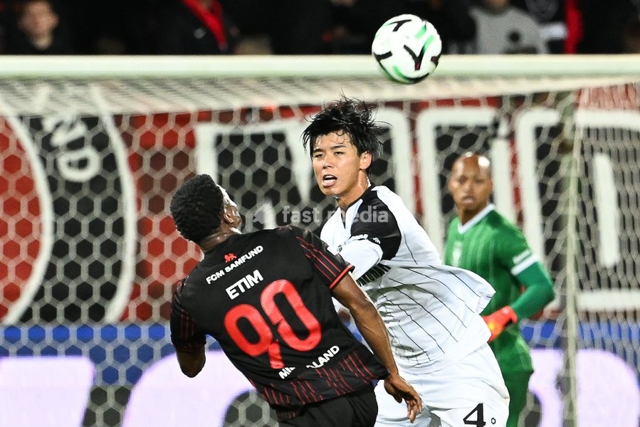Midtjylland's Friday Etim and STVV's Kota Takai pictured in action during a soccer game between Danish FC Midtjylland and Belgian Sint-Truidense VV, Thursday 22 October 2026 in Herning, Denmark, on the second day of the UEFA Conference League league phase