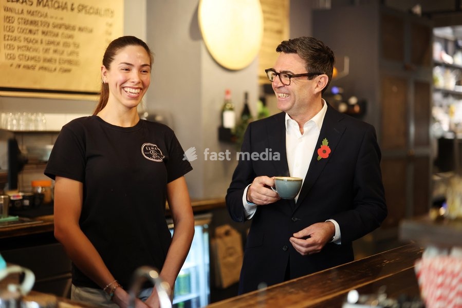 23/10/2026. Manchester, United Kingdom. Prime Minister Andy Burnham meets staff as he visits Ezra & Gil Cafe