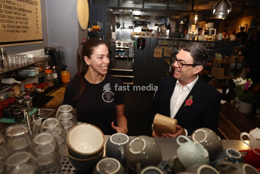 23/10/2026. Manchester, United Kingdom. Prime Minister Andy Burnham meets staff as he visits Ezra & Gil Cafe