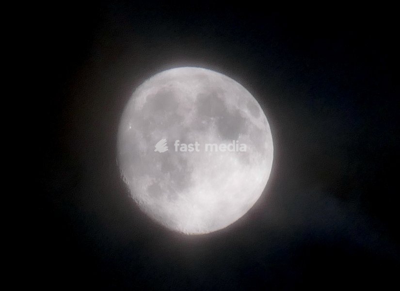 The waxing gibbous moon rises on a stormy night in the countryside. Visible at 92.7% This intermediate Moon phase starts after the First Quarter Moon and lasts until the Full Moon