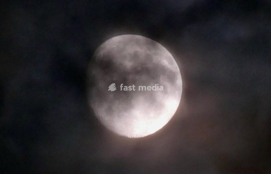 The waxing gibbous moon rises on a stormy night in the countryside. Visible at 92.7% This intermediate Moon phase starts after the First Quarter Moon and lasts until the Full Moon