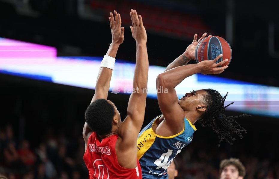 Spirou's Nigel Hawkins and Oostende's Adam Miller fight for the ball during a basketball match between Spirou Charleroi and BC Oostende, Friday 23 October 2026 in Charleroi, on day 4 of the 'BNXT League' Belgian and Dutch first division basket championship
