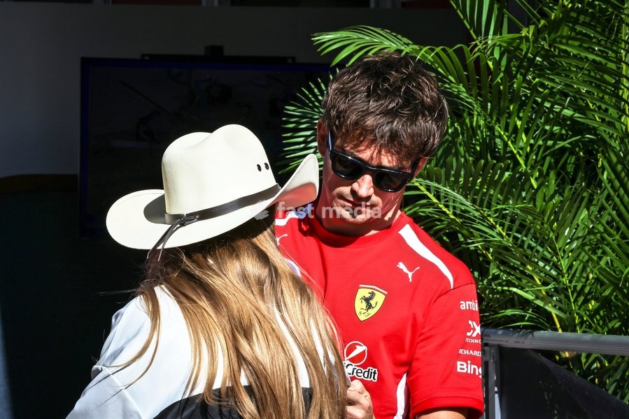 AUSTIN, UNITED STATES - OCTOBER 23: Charles Leclerc of Monaco and Scuderia Ferrari HP talks with a guest in the paddock during first practice of the Formula 1 MSC Cruises United States Grand Prix 2026 at Circuit of the Americas on October 23, 2026 in Austin, United States