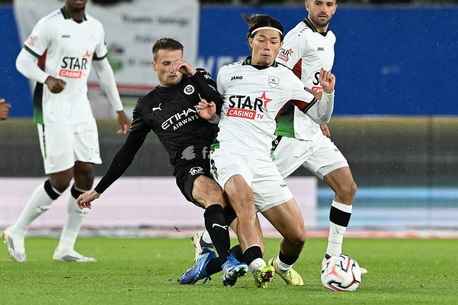 Lommel's Lucas Schoofs and OHL's Takuya Ogiwara pictured in action during a soccer match between Oud-Heverlee Leuven and Lommel SK, Saturday 24 October 2026 in Heverlee, on day 9 of the 2026-2027 'Jupiler Pro League' first division of the Belgian championship