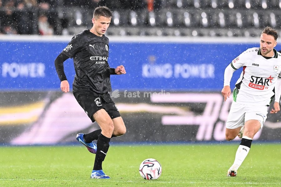 Lommel's Lucas Schoofs and OHL's Wouter George pictured in action during a soccer match between Oud-Heverlee Leuven and Lommel SK, Saturday 24 October 2026 in Heverlee, on day 9 of the 2026-2027 'Jupiler Pro League' first division of the Belgian championship