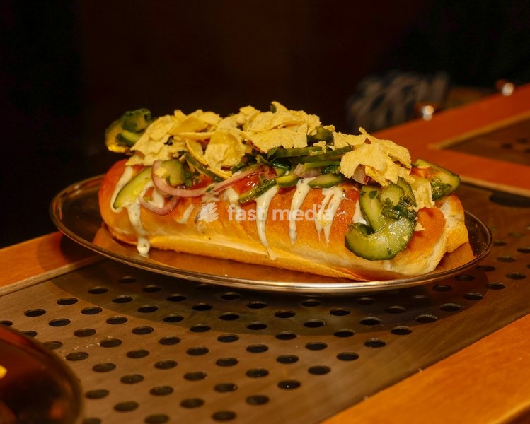 Currywurst Hot Dog with curry ketchup, mango chutney, raita, kachumber and poppadom at Altar in Leytonstone, London, United Kingdom