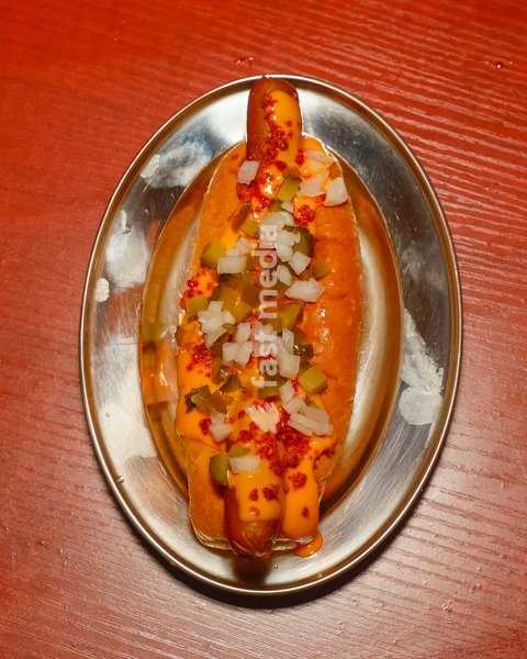 Chilli Bacon Cheese Hot Dog with nacho cheese, bacon, jalapeño, gherkin and onion at Altar in Leytonstone, London, United Kingdom