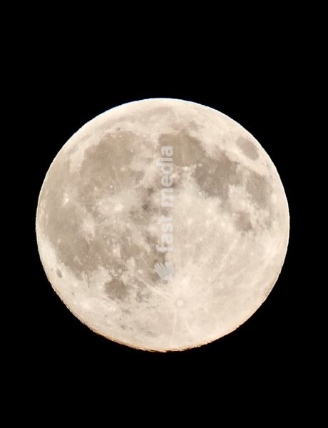 The full Hunters Moon in the evenings sky