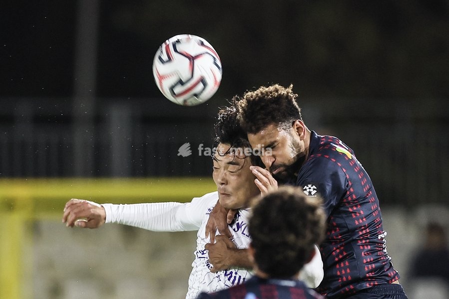 Patro Eisden's Seok-Ju Hong and Liege's Pierre-Yves Ngawa fight for the ball during a soccer match between RFC Liège and Patro Eisden Maasmechelen, on Sunday 25 October 2026 in Liege, on day 8 of the 2026-2027 'Challenger Pro League' second division of the Belgian championship