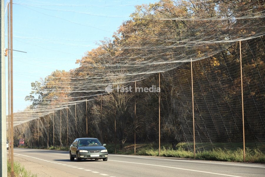 A car drives along a road covered with an anti-drone net, Kharkiv, Ukraine, October 24, 2026. Anti-drone nets are being installed to protect civilians and vehicles from Russian UAV strikes