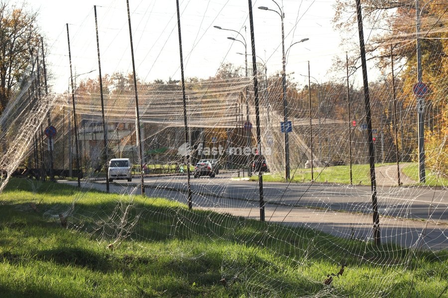 Cars drive along a road covered with an anti-drone net, Kharkiv, Ukraine, October 24, 2026. Anti-drone nets are being installed to protect civilians and vehicles from Russian UAV strikes