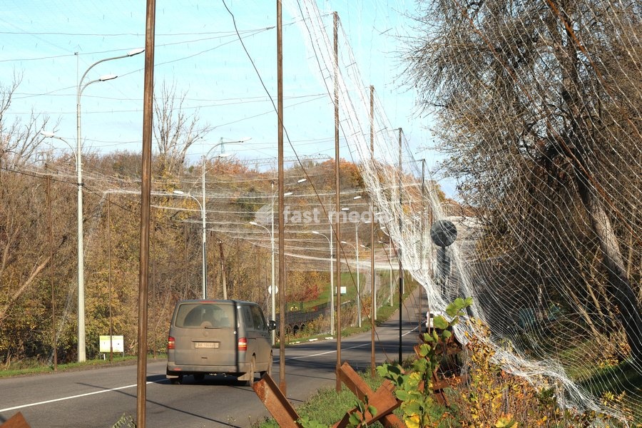 A van drives along a road covered with an anti-drone net, Kharkiv, Ukraine, October 24, 2026. Anti-drone nets are being installed to protect civilians and vehicles from Russian UAV strikes