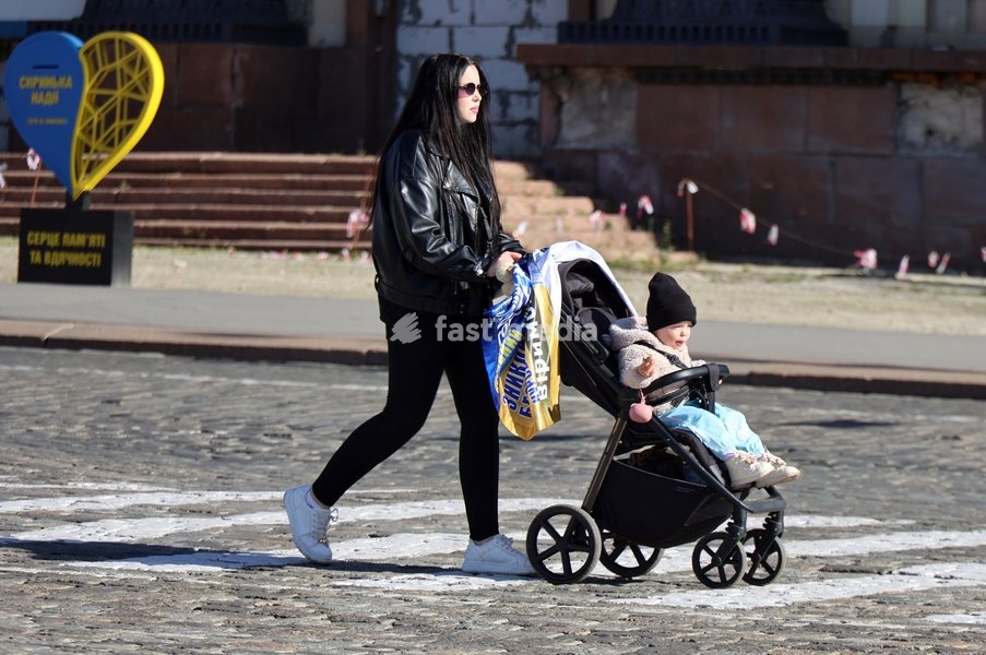 A woman pushes a stroller with a baby along a zebra crossing during the “Don’t Stay Silent! Captivity Kills!” rally in support of Ukrainian prisoners of war and MIAs, Kharkiv, Ukraine, October 25, 2026