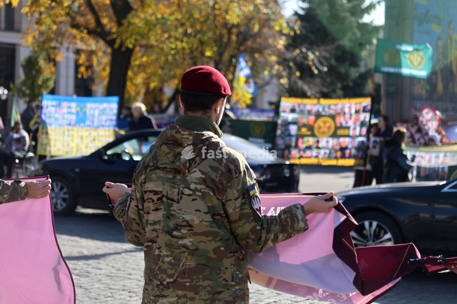 A serviceman holds a banner during the “Don’t Stay Silent! Captivity Kills!” rally in support of Ukrainian prisoners of war and MIAs, Kharkiv, Ukraine, October 25, 2026