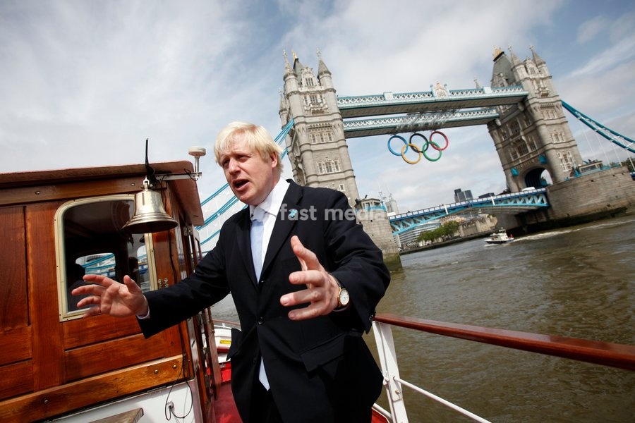 Mayor of London Boris Johnson poses for a photograph as a giant set of Olympic rings are displayed from Tower Bridge on June 27, 2012 in London, England. The rings weigh over three tonnes and measure over 25 metres wide by 11.5 metres tall; they will be illuminated in a light-show every evening…