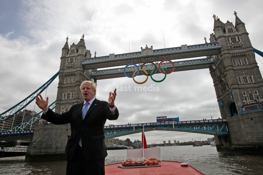 Mayor of London Boris Johnson poses for a photograph as a giant set of Olympic rings are displayed from Tower Bridge on June 27, 2012 in London, England. The rings weigh over three tonnes and measure over 25 metres wide by 11.5 metres tall; they will be illuminated in a light-show every evening…