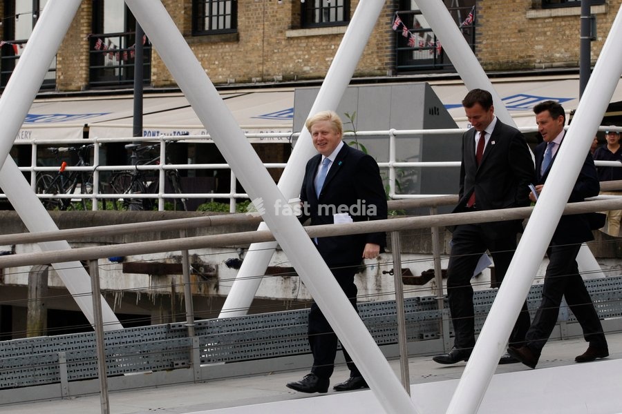 Mayor of London Boris Johnson (L) Lord Sebastian Coe, The Chair of the London Organising Committee of the Olympic Games and British Culture Secretary (R)Jeremy Hunt (C), arrive as a giant set of Olympic rings are displayed from Tower Bridge on June 27, 2012 in London, England. The rings weigh over…