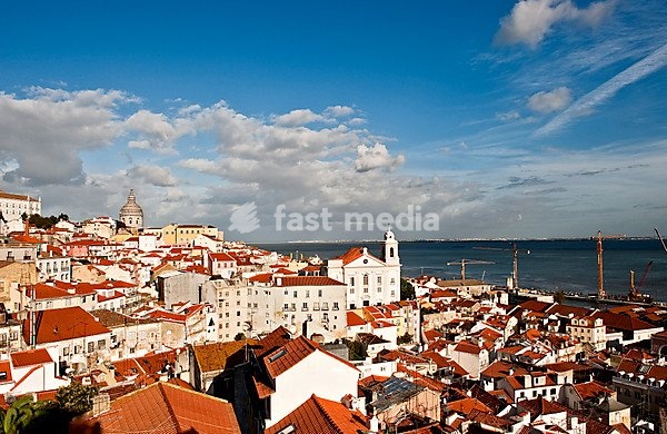 View from Miradouro Santa Luzia over the Alfama district on the Tagus river, on the right the church Igreja Sao Vicente de Fora, Lisbon, Portugal, Europe