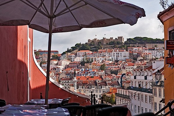 Tables in a restaurant in the Calcada do Duque, Bairro Alto district, in the back the castle hill with castle Castelo Sao Jorge, Lisbon, Portugal, Europe