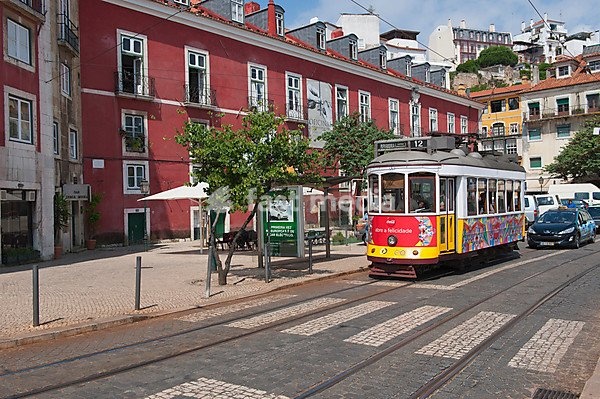 Tram in a street in Alfama district, Lisbon, Portugal, Europe